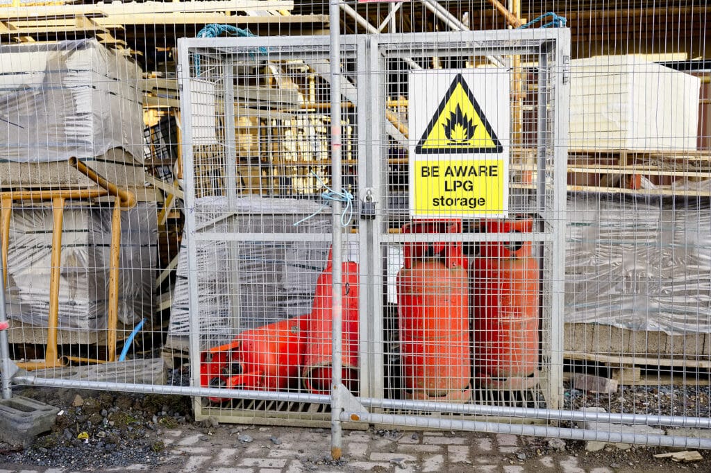 A photo of gas cylinders in a bottle cage