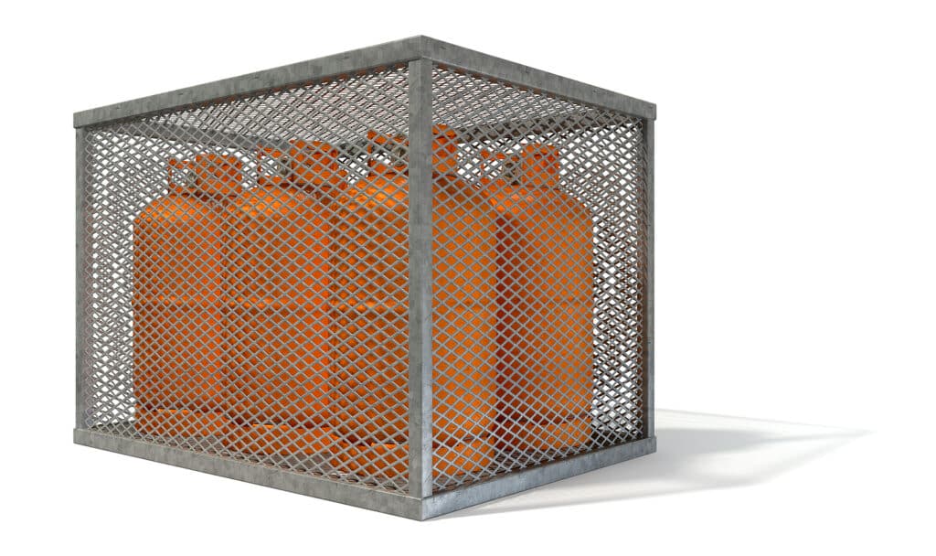A rectangular steel cage covered in diamond mesh wiring with orange gas bottles inside on an isolated white background